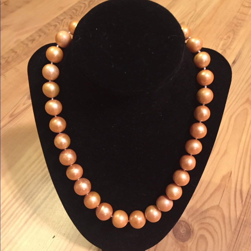 Large genuine golden pearl necklace. $960.